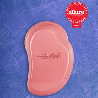 St. Tropez, Tangle Teezer, and BareMinerals products on a blue background